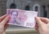 НБУ выпускает обновленные банкноты в 200 гривен: надо ли украинцам обменивать в банках деньги