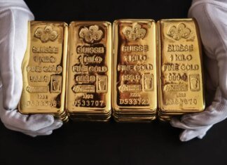 Золото стабилизировалось после заявления ФРС о контроле инфляции, несмотря на напряженность на Ближнем Востоке